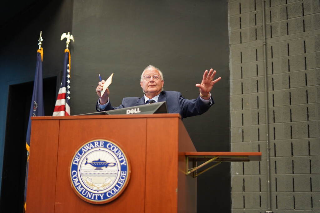 Barry Dozor speaking at a podium.