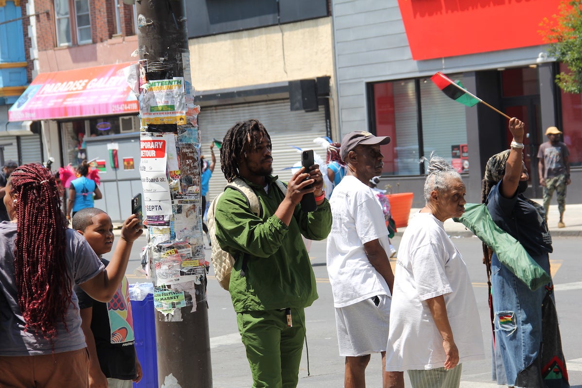 People made sure to capture moments during the parade while hanging out on 52nd Street