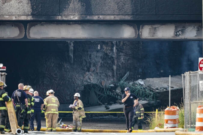 Crews work to contain a tanker fire underneath an Interstate 95 overpass in Philadelphia on Sunday, June 11, 2023