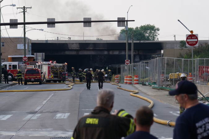 First responders work to extinguish a vehicle fire, Sunday June 11, 2023, that caused an overpass on I-95 to collapse near the Cottman Avenue exit