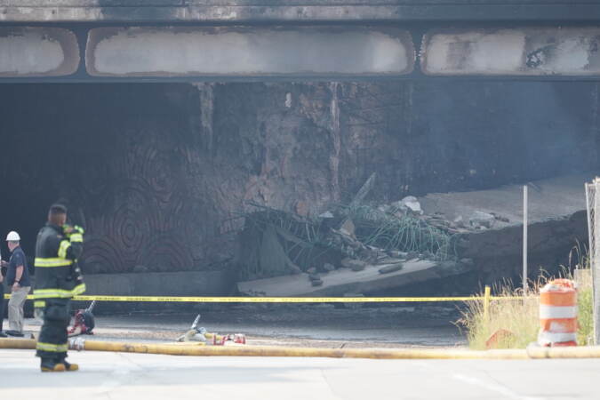 First responders work to extinguish a vehicle fire, Sunday June 11, 2023, that caused an overpass on I-95 to collapse near the Cottman Avenue exit