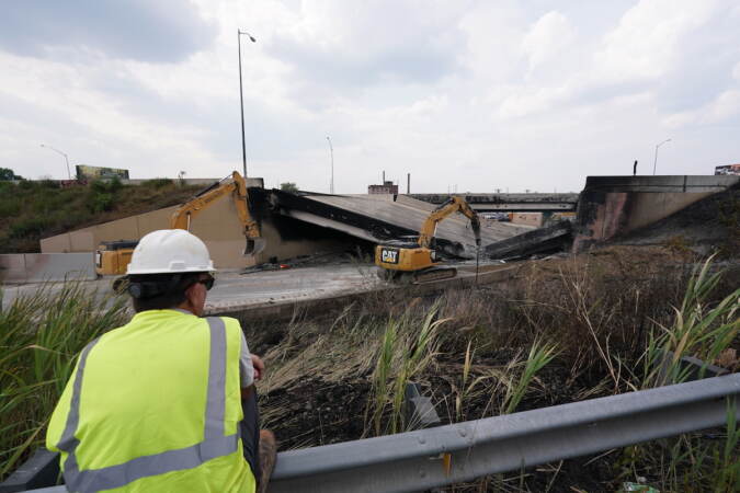 Crews work to remove rubble from a collapsed section of I-95, Sunday June 11, 2023, after a vehicle fire caused an overpass on I-95 to collapse near Cottman Avenue. (Joseph Kaczmarek for WHYY)