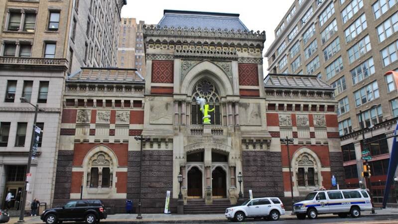 KAWS' Born to Bend will be on the facade of PAFA's Furness building through August, 2014. (Kimberly Paynter/WHYY)