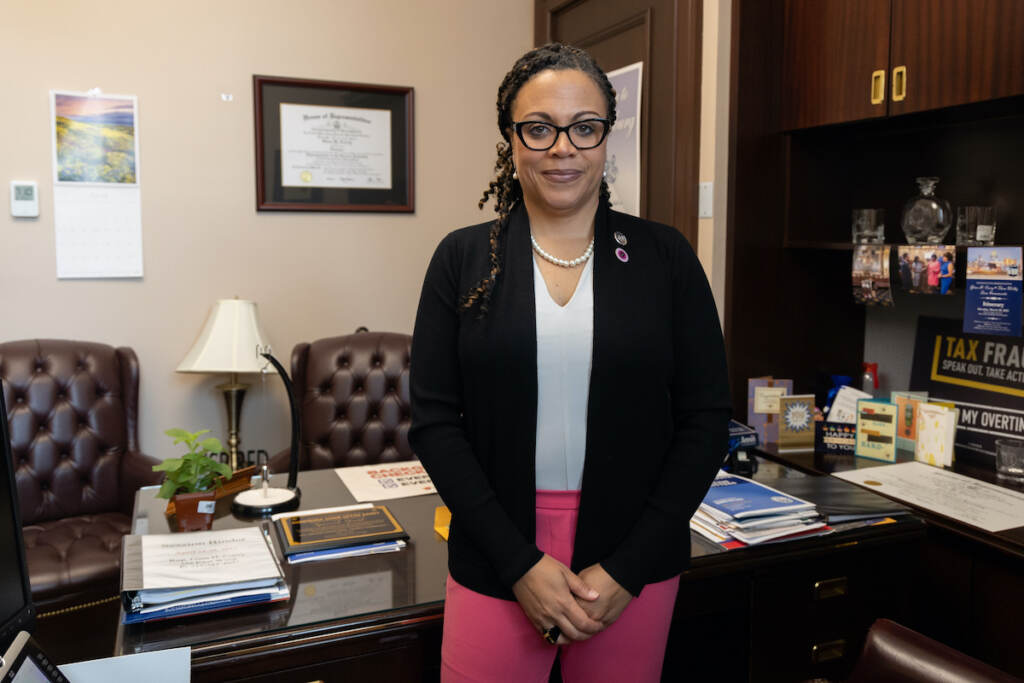 Rep. Gina Curry posing in her office
