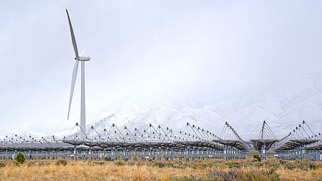 The photo shows a single wind turbine