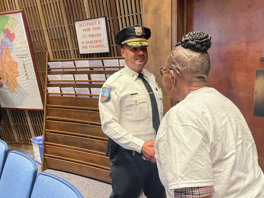 Chief Campos shaking the hand of Danette Butler