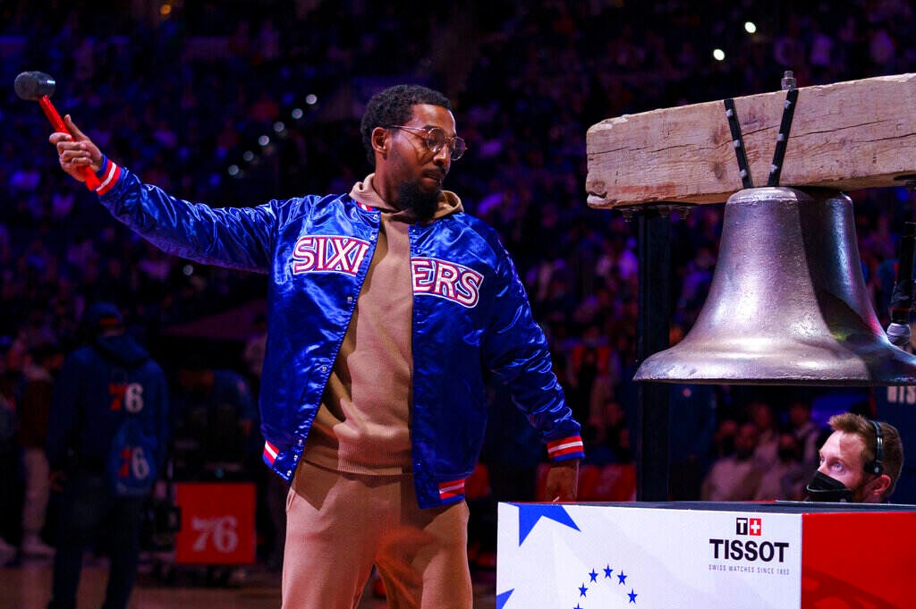 Chill Moody rings the bell at a 76ers game.