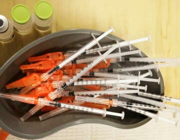 a bowl of syringes.