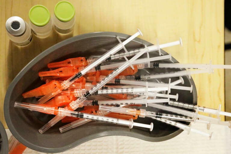 a bowl of syringes.