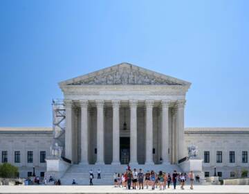 The U.S. Supreme Court building is visible on a sunny day.