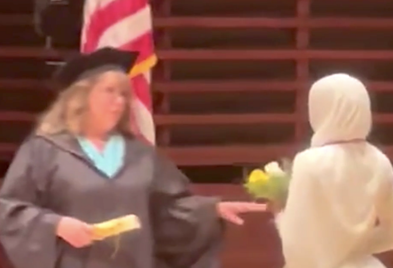 Graduation ceremony, with student getting denied a diploma.