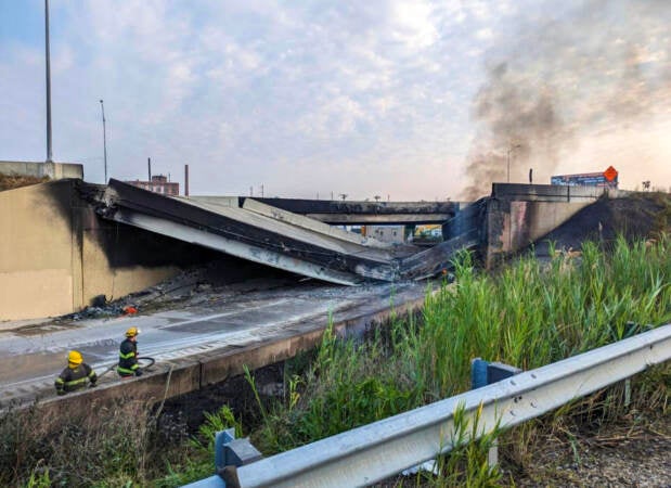 The highway collapse as seen from ground level nearby