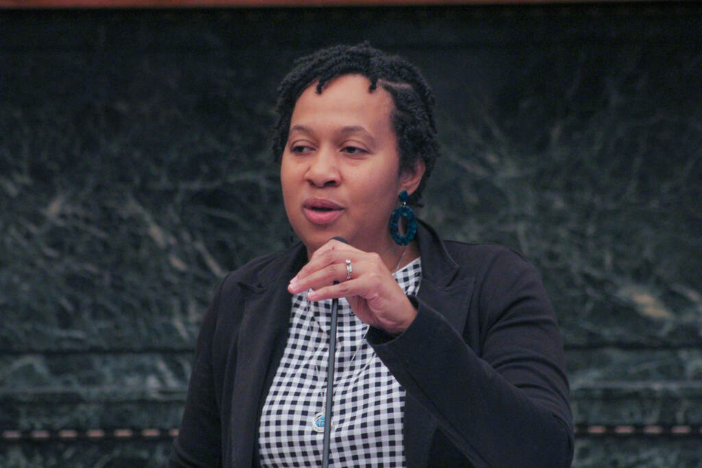 Josie Pickens speaking at a podium