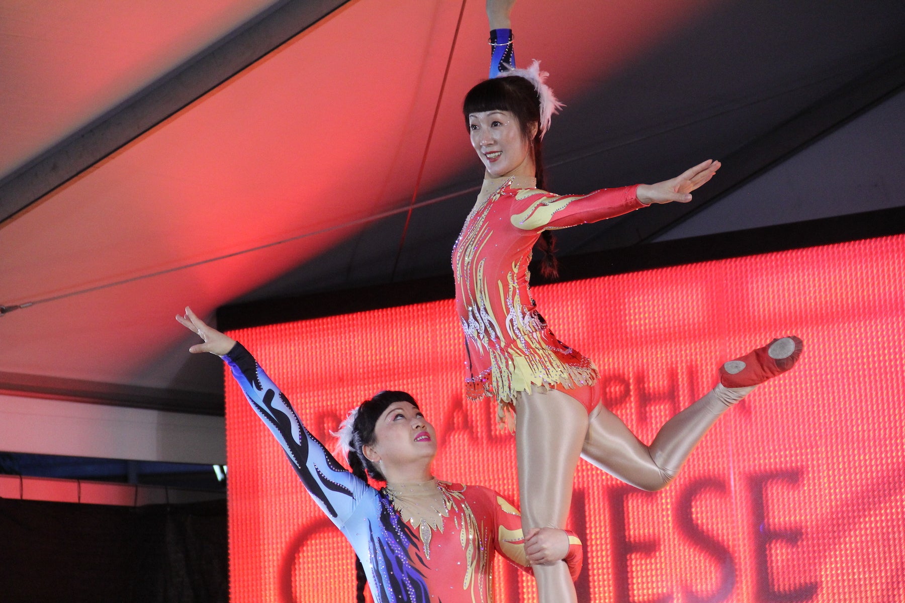 Acrobats perform on stage
