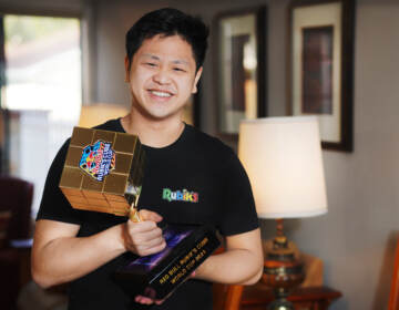 Max Park, pictured after winning a December 2021 competition, recently set a world record for solving a 3x3x3 Rubik's cube in 3.13 seconds.