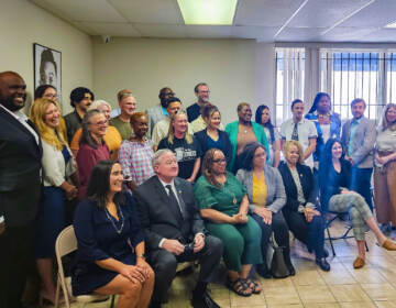 Mayor Jim Kenney posing with a large group of community leaders