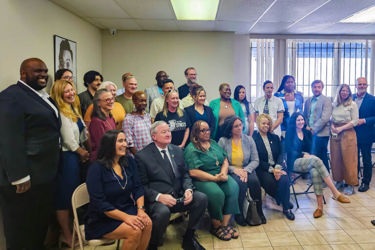 Mayor Jim Kenney posing with a large group of community leaders