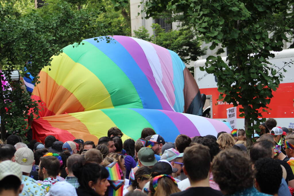 Massive pride flag getting unfurled at Philly Pride.