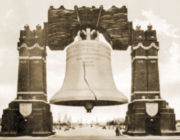 Historical photo of the 'Luminous Liberty Bell' hanging across Broad Street.