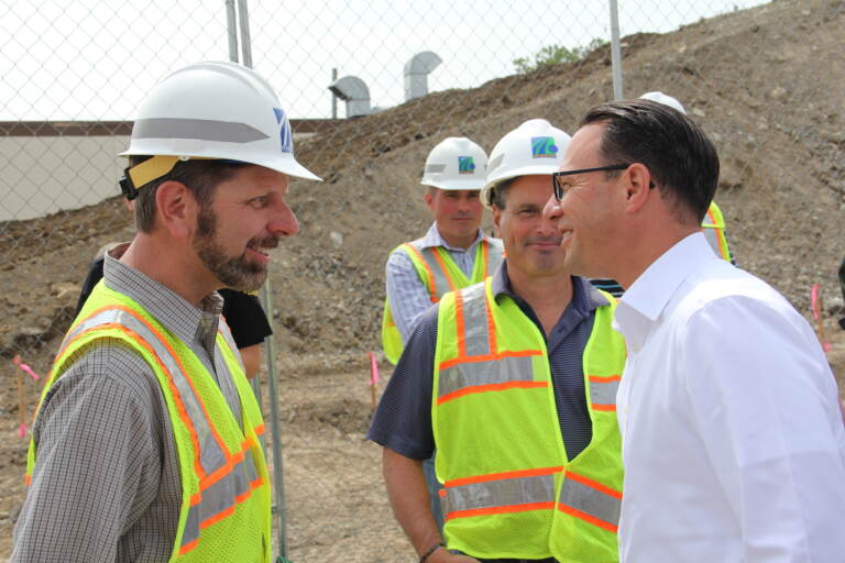 Josh Shapiro speaking with construction workers