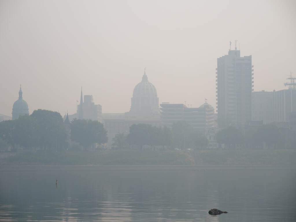 The Pa. Capitol building is seen obscured by smoke