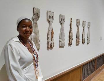 Artist Adebunmi Gbadebo stands with her piece “Remains, piece of Balcony Baluster, 1848,