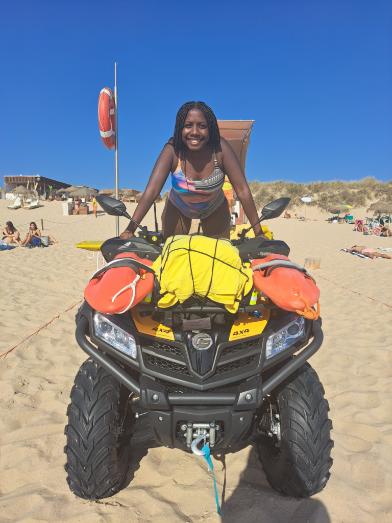 Twanna Hines at the beach on an ATV.