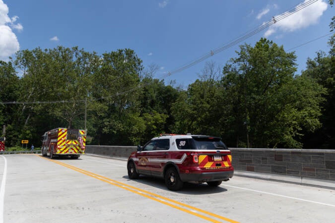 Delaware County ambulances and other emergency responders drive over the Mt. Alverno Bridge.