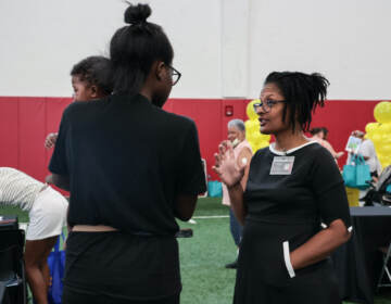 Dr. Sharee Livingston Obstetrician-Gynecologist at UPMC chats with moms at the community baby shower