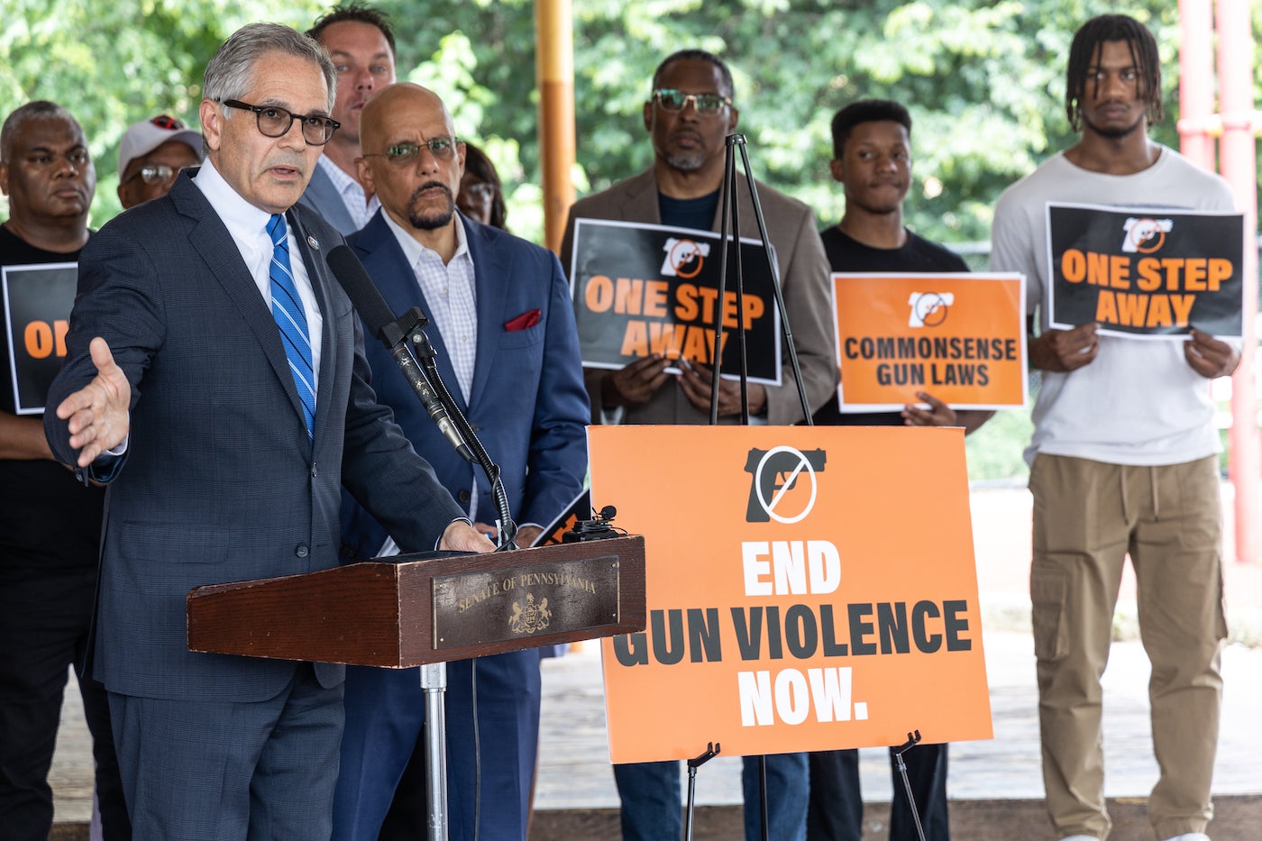 Larry Krasner speaking at a podium.