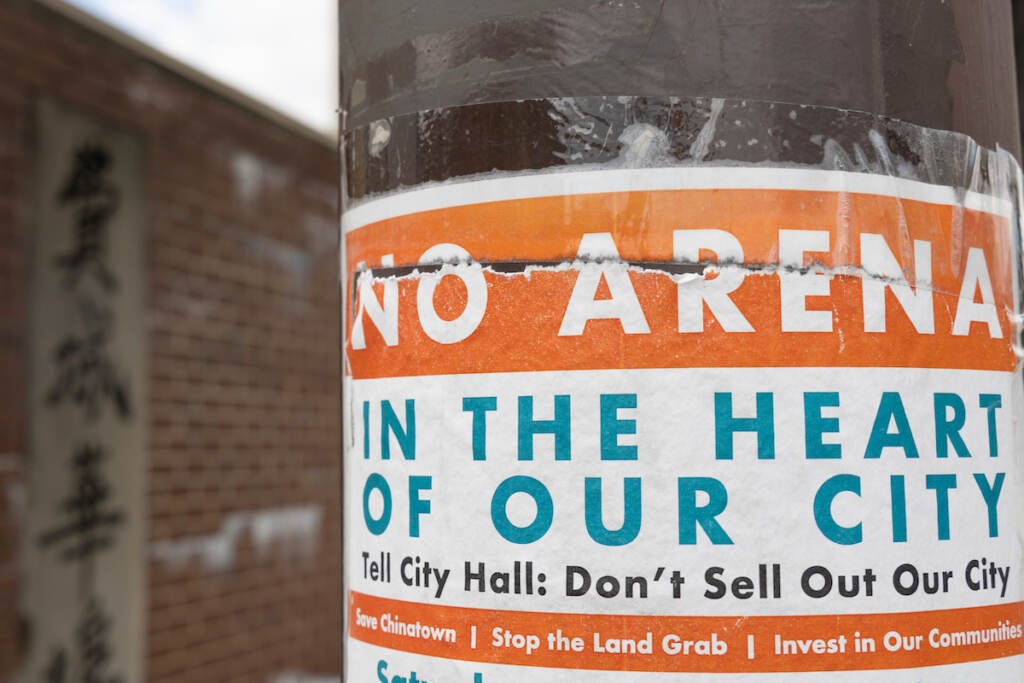 A sign on a telephone pole reads "No Arena in the Heart of Our City."