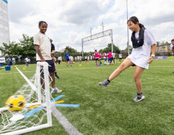 Chelsea professional football player Raheem Sterling helps Philadelphia kids learn how to play soccer at the Chelsea Foundation’s Football Festival at Cristo Rey High School on July 24, 2023