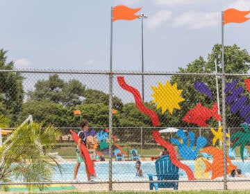 Kids play at a pool.