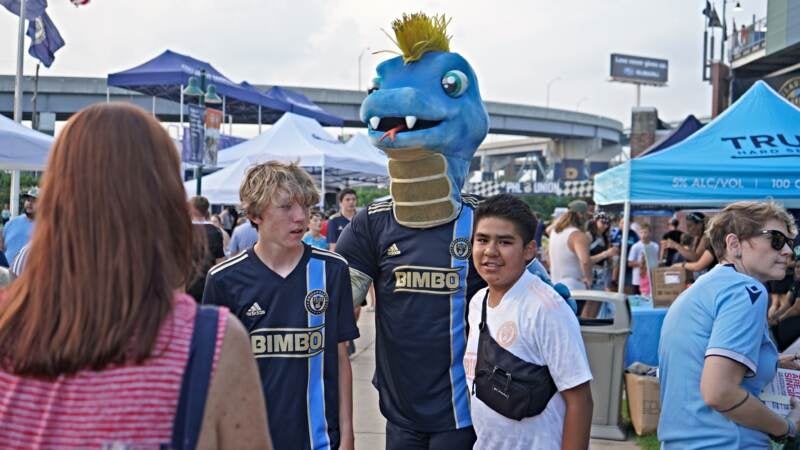 Philadelphia Union mascot Phang poses with fans ahead of the Union II's game against Welsh side Wrexham