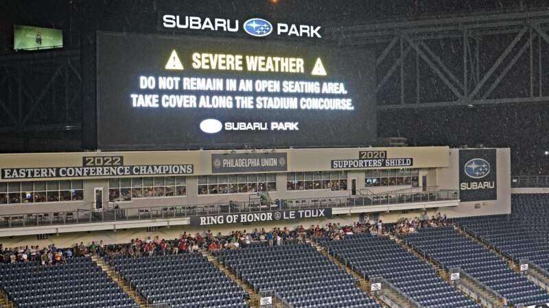 Safety instructions are shown on the big screen at Subaru Park during half time between the Philadelphia Union and Welsh side Wrexham.