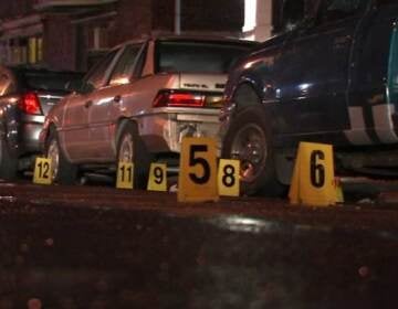 Evidence markers litter the scene of a mass shooting in Philly on July 3, 2023.