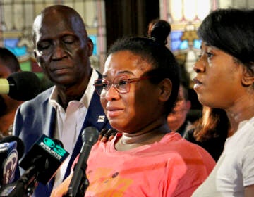 Josephine Wamah (center) and Jasmine Wamah, sisters of shooting victim Joseph Wamah Jr., 31, share their feelings during a press conference at the Salt and Light Church in Kingsessing.