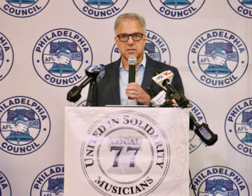 Jonathan Fink speaks at a podium.