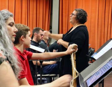 Elizabeth Braden conducts Opera Philadelphia in a rehearsal.