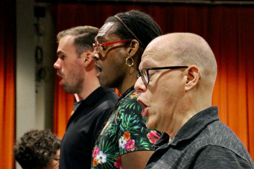 From left, Michael Miller, Cory O'Niell Walker, and John David Miles sing