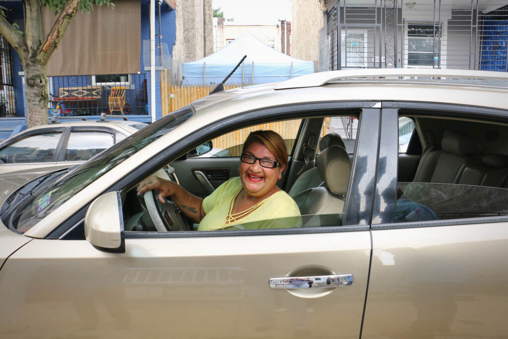 Annamarie Rosado poses for a photo while driving in her car.