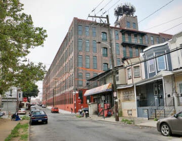 A view of a former factory building, now affordable housing units, from the outside.