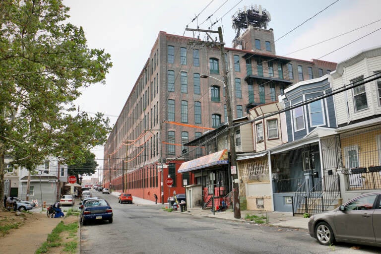 A view of a former factory building, now affordable housing units, from the outside.