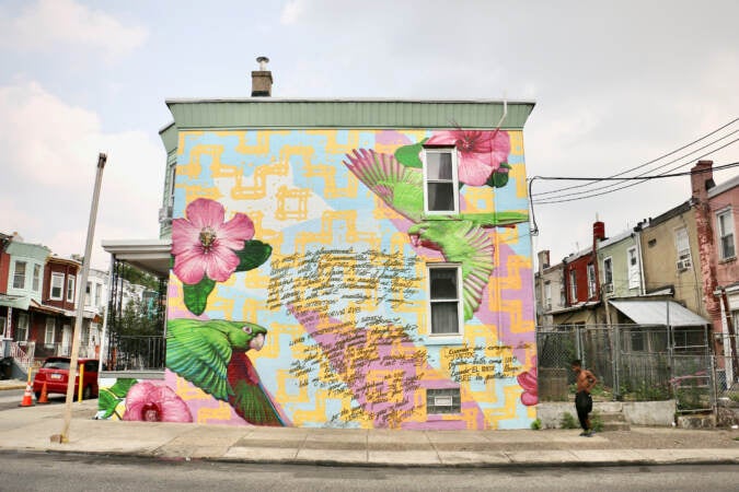 Murals along Indiana Avenue feature poems written by residents. They were made in collaboration with Mural Arts Philadelphia and poet Ursula Rucker. (Emma Lee/WHYY)