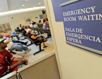 FILE - In this July 30, 2009 photo, patients wait in the emergency room at Cook County Hospital in Chicago. Senate Democrats passed a landmark health care bill Thursday, Dec. 24, 2009,  that could define President Barack Obama's legacy and usher in near-universal medical coverage for the first time in U.S. history. (AP Photo/Paul Beaty, file)