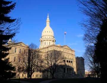 The Michigan Capitol building stands in Lansing, Mich., Dec. 12, 2012. Michigan's revenue will be nearly $900 million less this year than forecasted in January due to new tax cuts, state officials said Friday, May 19, 2023, leaving lawmakers with less money to spend as they work toward the state's next budget