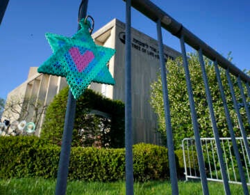 File photo: A Star of David hangs from a fence outside the dormant landmark Tree of Life synagogue in Pittsburgh's Squirrel Hill neighborhood, April 19, 2023.