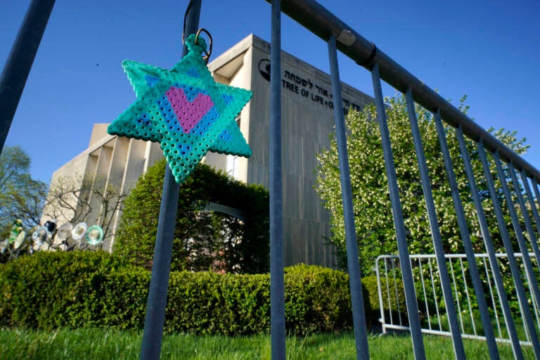 File photo: A Star of David hangs from a fence outside the dormant landmark Tree of Life synagogue in Pittsburgh's Squirrel Hill neighborhood, April 19, 2023.