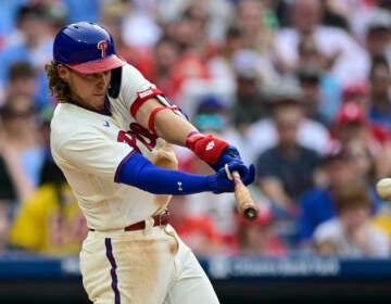 Philadelphia Phillies' Alec Bohm hits an RBI-single off Washington Nationals' Thaddeus Ward during the fifth inning of a baseball game, Saturday, July 1, 2023, in Philadelphia.