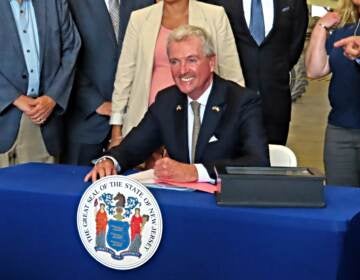 New Jersey Gov. Phil Murphy signs a bill in Paulsboro, N.J., Thursday, July 6, 2023, granting a tax break to offshore wind energy developer Orsted